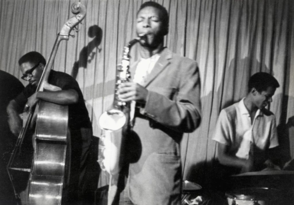 Ornette-Coleman-alto-saxophone-Ben-Tucker-bass-Sonny-Gillette-drums-at-the-Cellar-photographer-unknown